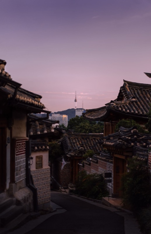 Seochon rooftops with Namsan tower at dusk
